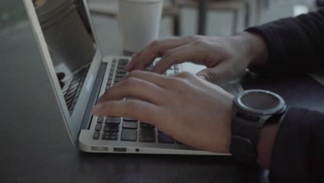 Cropped-shot-of-man-typing-on-laptop-computer